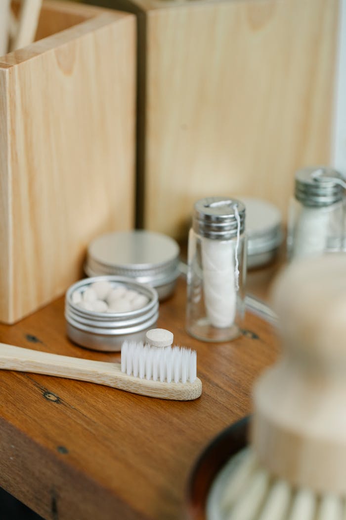 Toothbrush near dental floss in bathroom